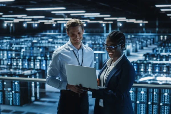 Data Center Female System Administrator and Male IT Specialist talk Data Center Female System Administrator and Male IT Specialist talk